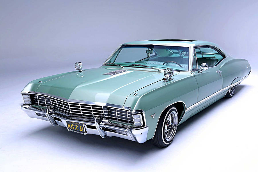 Vintage Elegance - The 1967 Chevrolet Impala In Stunning Teal Wallpaper