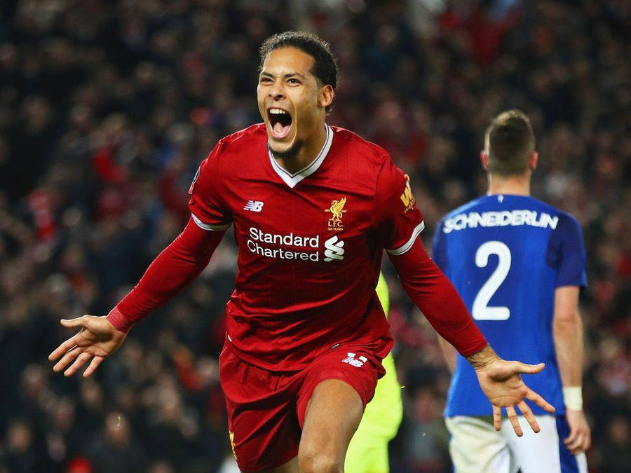 Virgil Van Dijk Roaring In Red Liverpool Fc Jersey Wallpaper