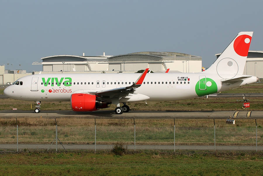 Viva Aerobus Airplane Inside Airport Fence Wallpaper