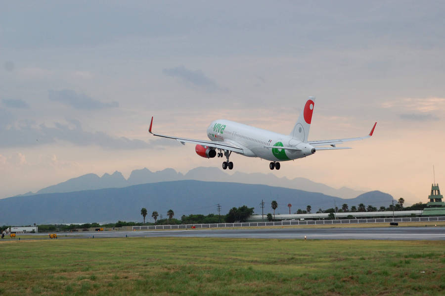 Viva Aerobus Taking Off From Airport Runway Wallpaper