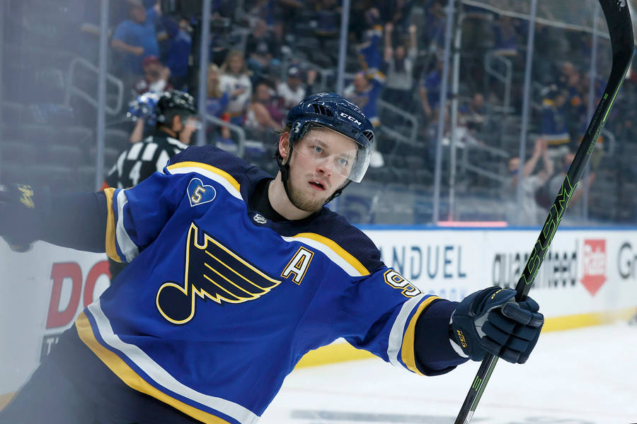 Vladimir Tarasenko Holding Hockey Stick With Left Hand And Holding Side Rink Rails Wallpaper