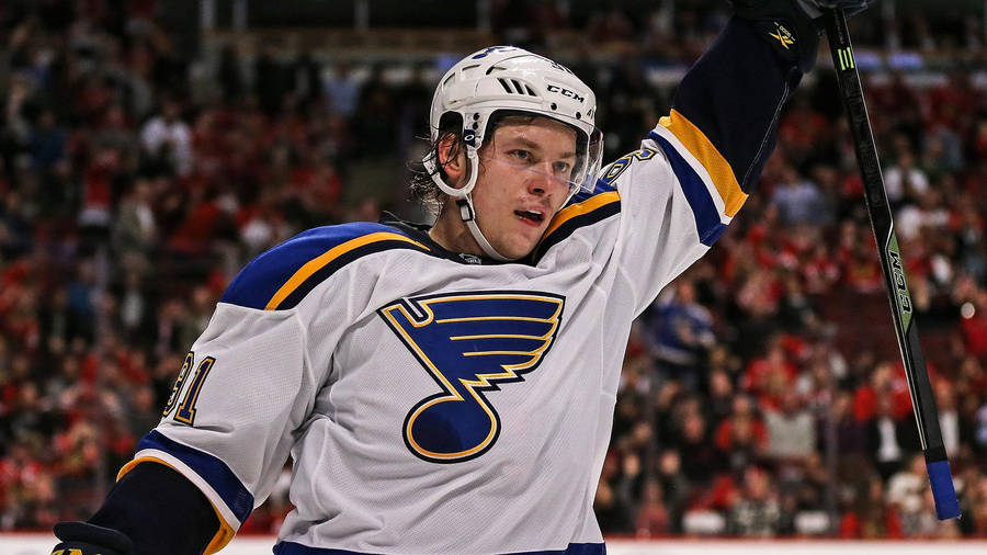 Vladimir Tarasenko Wearing White Team Jersey While Holding Hockey Stick With Left Hand Wallpaper