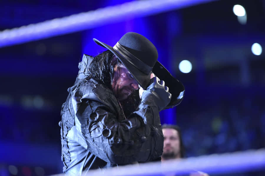 W W E Undertaker Iconic Pose Ring Entrance Wallpaper