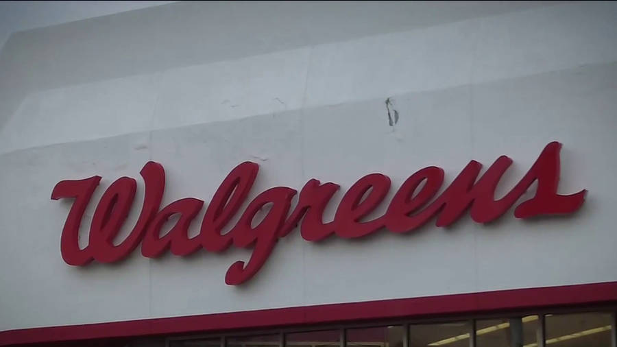 Walgreens Logo On White Concrete Wall Wallpaper