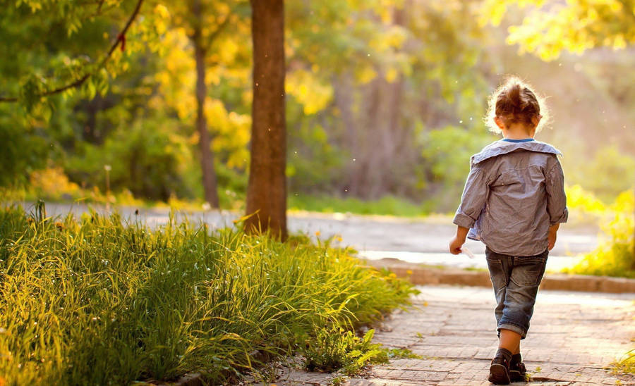 Walking Child On A Sunny Day Wallpaper