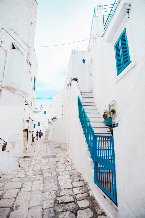 Walking In Blue And White Street Wallpaper