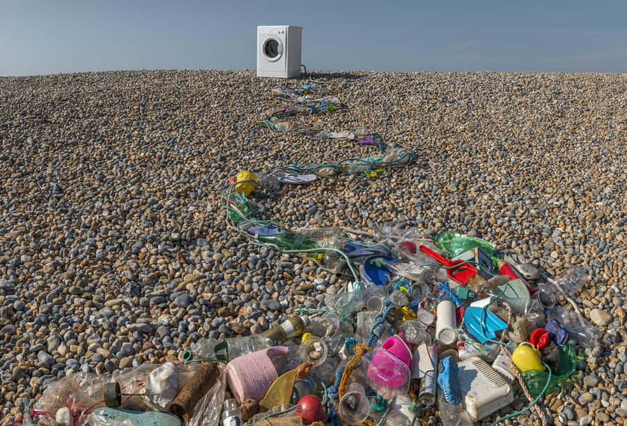 Washing Machine Amongst Beach Litter Wallpaper