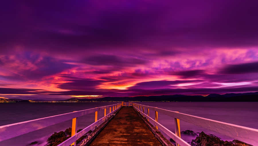 Watch The Perfect Blues And Purples Come Together In This Beautiful Sunset. Wallpaper