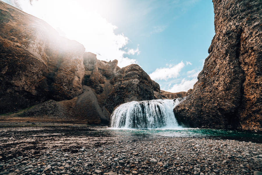 Waterfall Flowing Through Rocks Nature Scenery Wallpaper