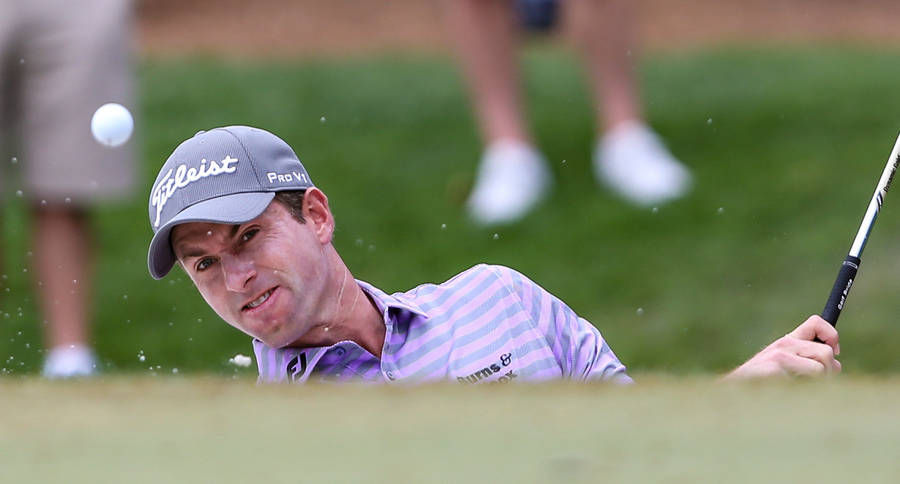 Webb Simpson Hitting A Golf Ball Hard Wallpaper