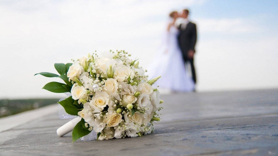 Wedding Bouquet With Kissing Couple Wallpaper