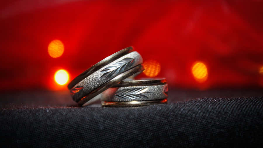 Wedding Ring Against Blurred Light Wallpaper