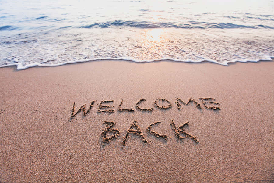 Welcome Back Beach Sand Writing Wallpaper