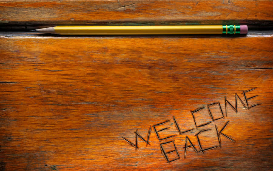 Welcome Back Pencilon Wooden Background Wallpaper