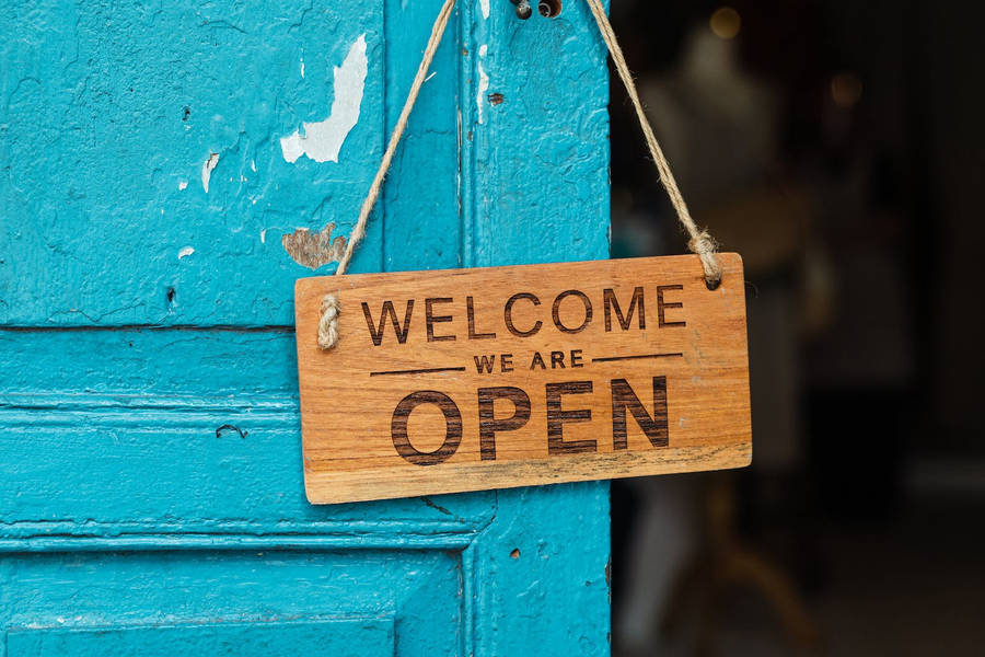 Welcome Sign On Teal Door Wallpaper