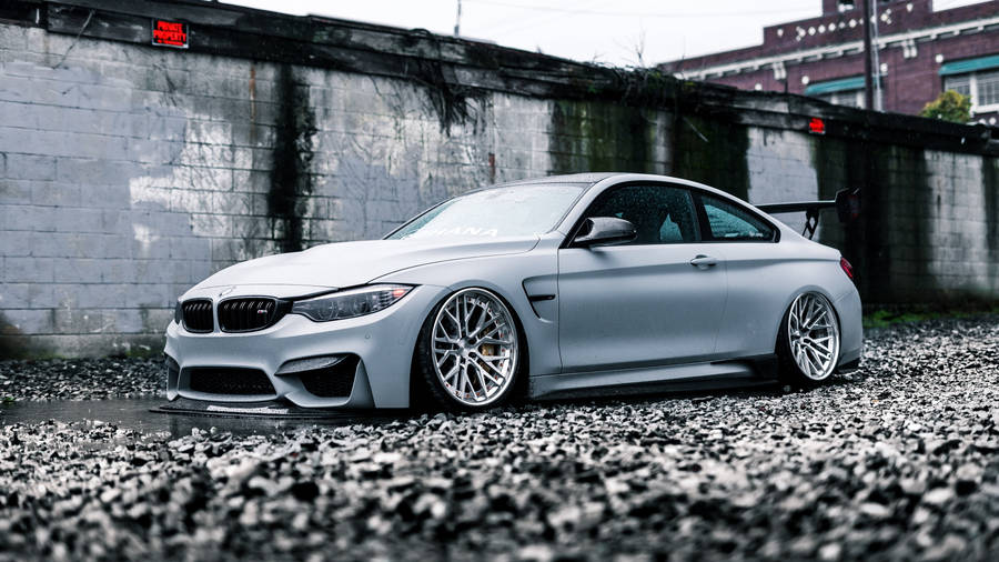 White Bmw M4 Stony Ground Wallpaper