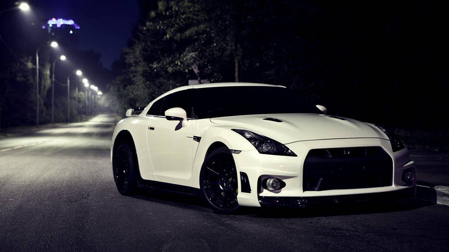 White Nissan Gtr Car On A Dark Road Wallpaper