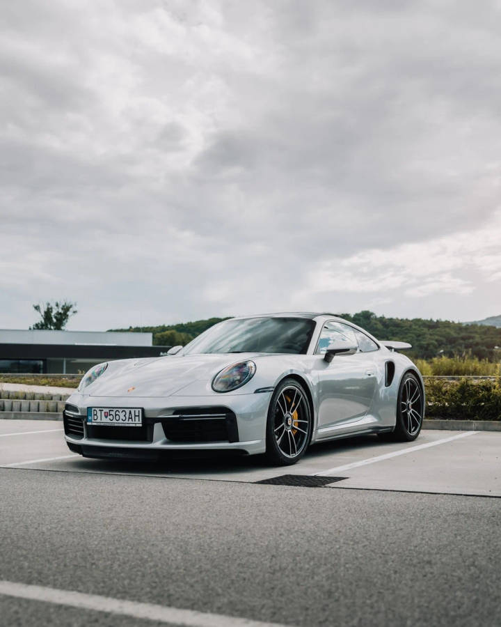 White Porsche 911 In Outdoor Parking Wallpaper