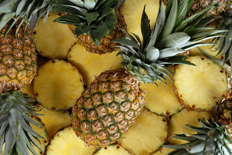 Whole And Sliced Pineapple Wallpaper