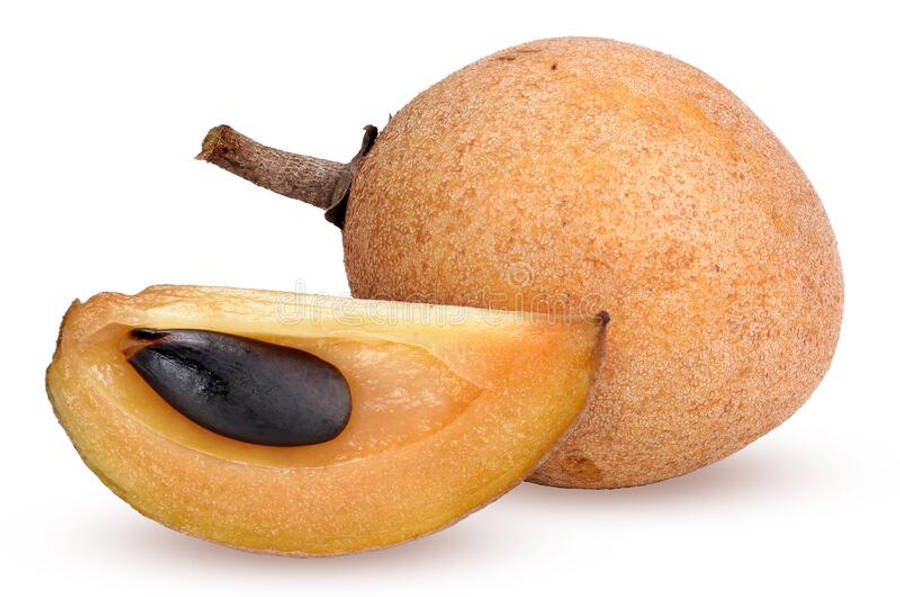 Whole And Sliced Sapodilla Fruit On A Wooden Table Wallpaper