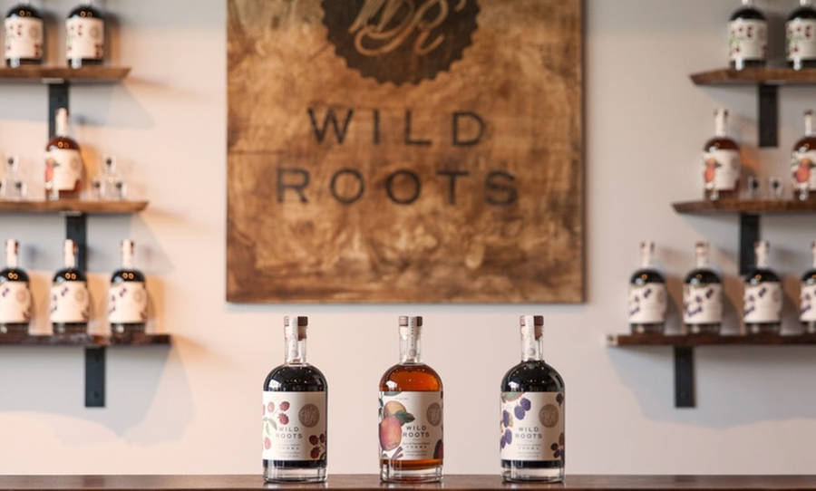 Wild Roots Logo And Vodka Wallpaper