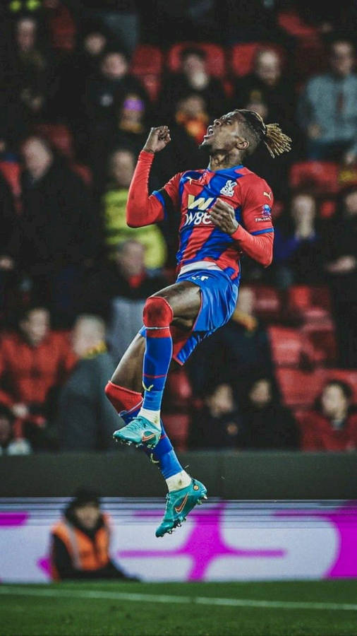 Wilfried Zaha Jumping High On Field Wallpaper