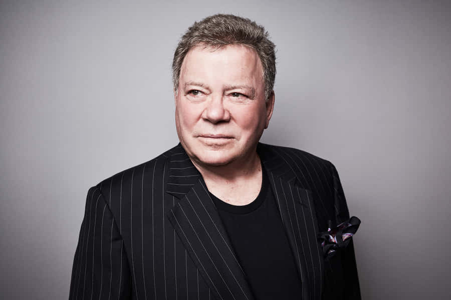 William Shatner Smiling In A Suit Wallpaper