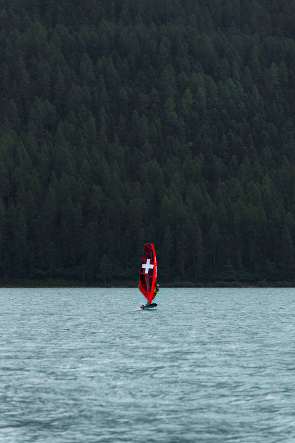 Windsurfing Sail With A Cross Wallpaper