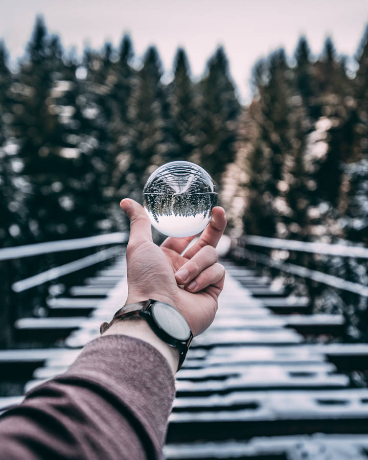 Winter Crystal Ball In Hand Wallpaper