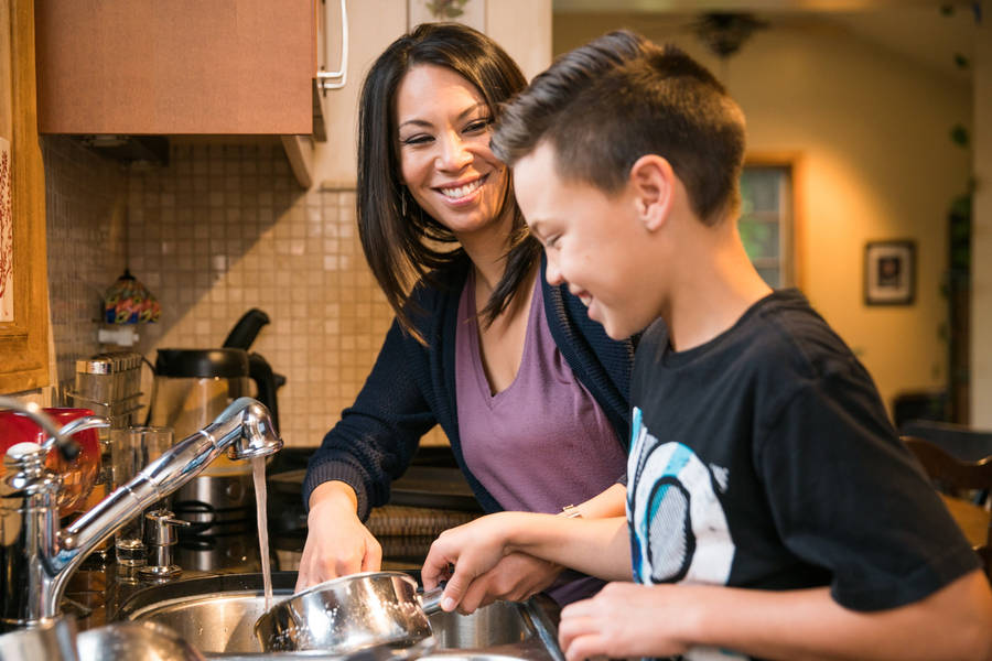 Woman And Boy House Cleaning Wallpaper