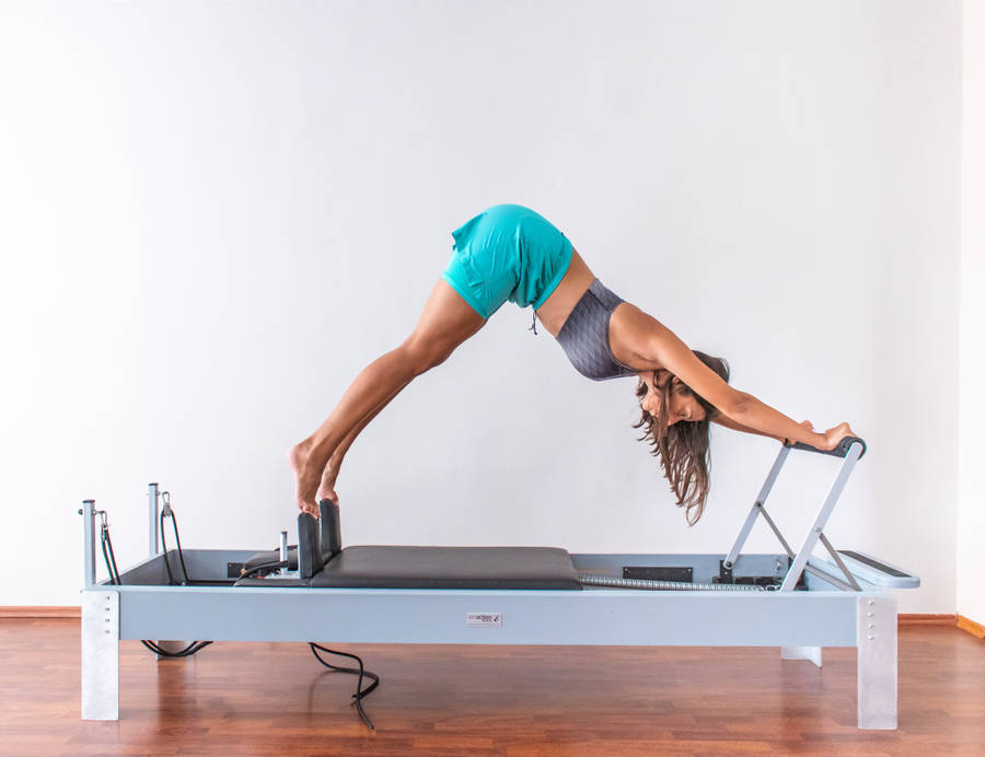 Woman Exercising Pilates Wallpaper