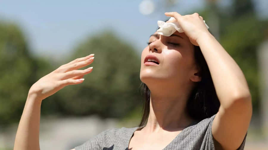 Woman Experiencing Heat Exhaustion.jpg Wallpaper