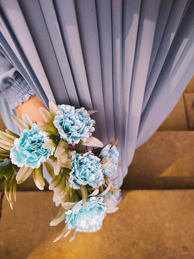 Woman Holding Blue Flowers Phone Wallpaper