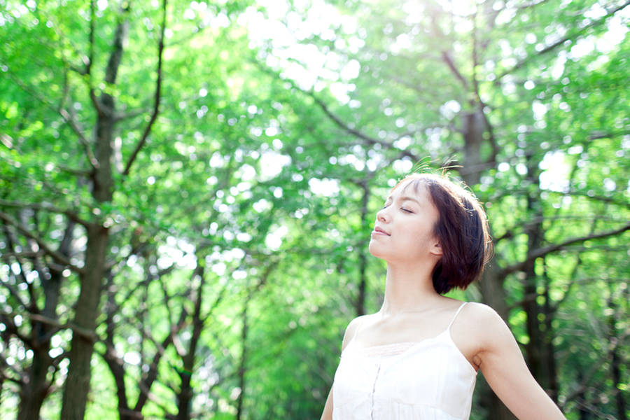 Woman In Forest Breathing Freely Wallpaper