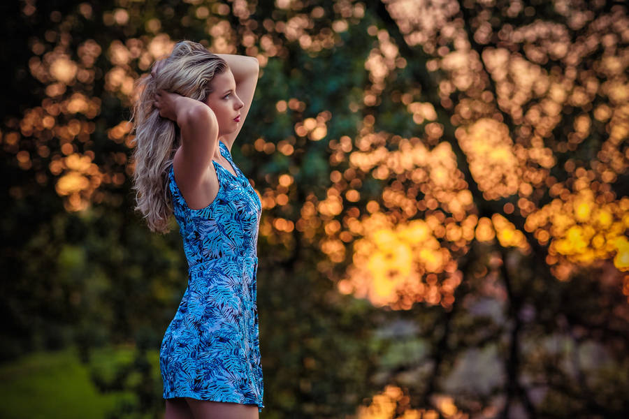 Woman Modelling A Beautiful Blue Dress Wallpaper