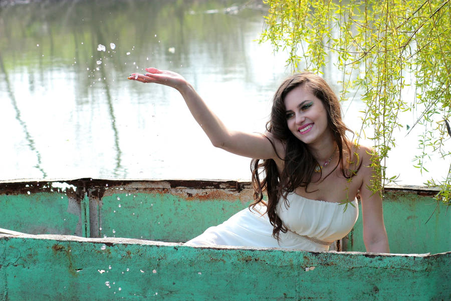 Woman On Boat With Cute Smile Wallpaper