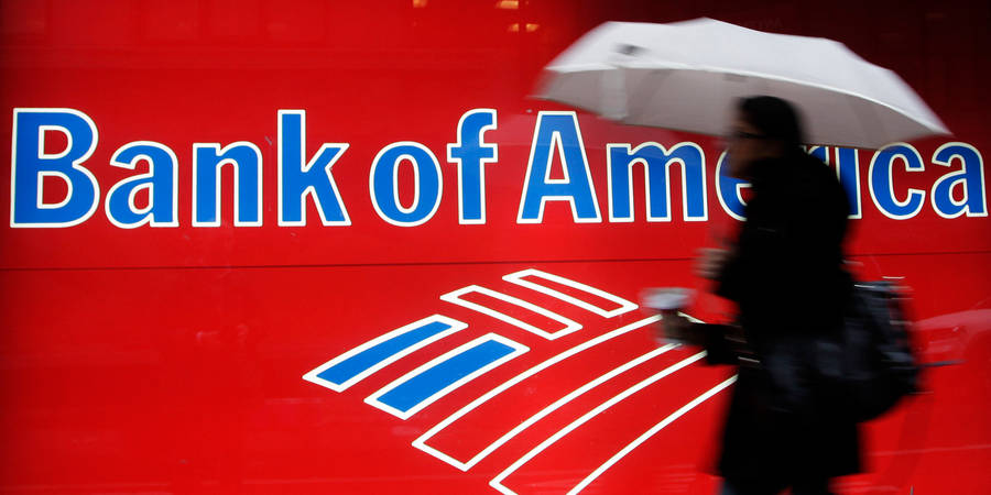 Woman Passing Bank Of America Signage Wallpaper