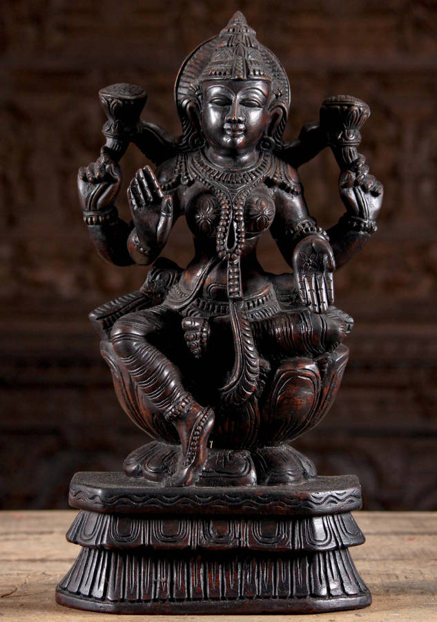 Wooden Lakshmi Devi Figurine Wallpaper