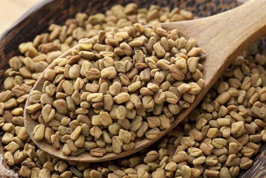 Wooden Spoon With Fenugreek Seeds Wallpaper