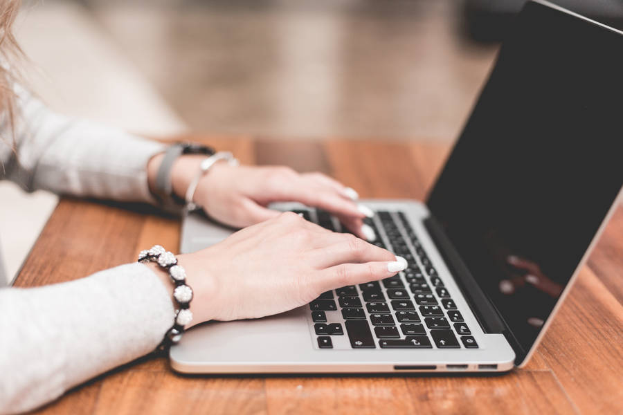 Work Girl Typing On Laptop Wallpaper