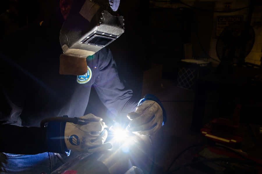 Working Together - Welders Joining Pieces Wallpaper