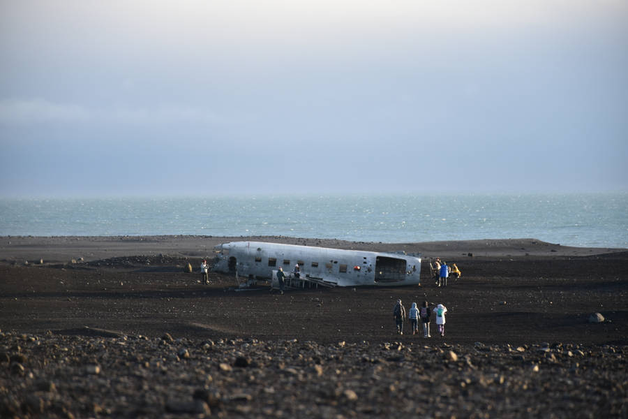 Wrecked Plane On Black Sand Wallpaper