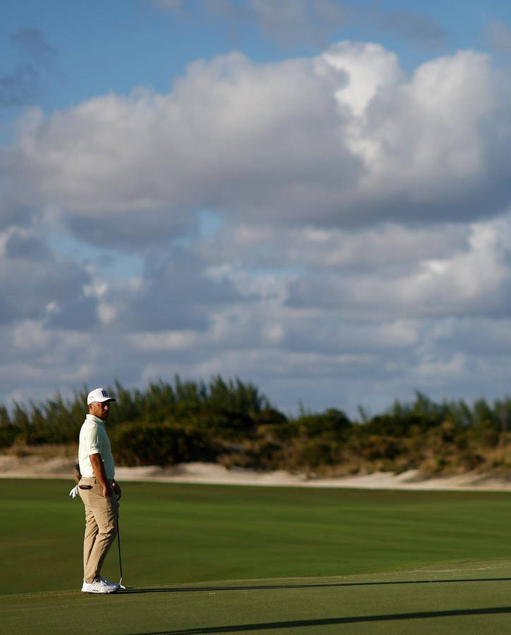 Xander Schauffele Standing On Golf Course Wallpaper