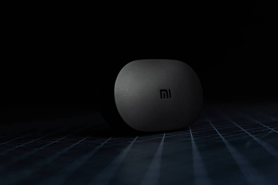 Xiaomi Device In Dark Room Wallpaper