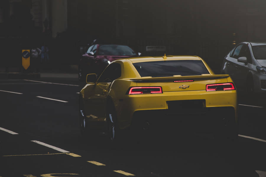 Yellow Chevrolet Car On Road Wallpaper