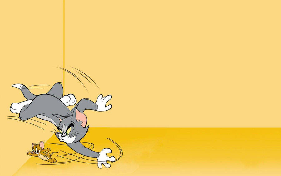 Yellow-colored Tom And Jerry Wallpaper