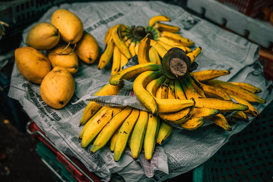 Yellow Fruits On Newspaper Wallpaper