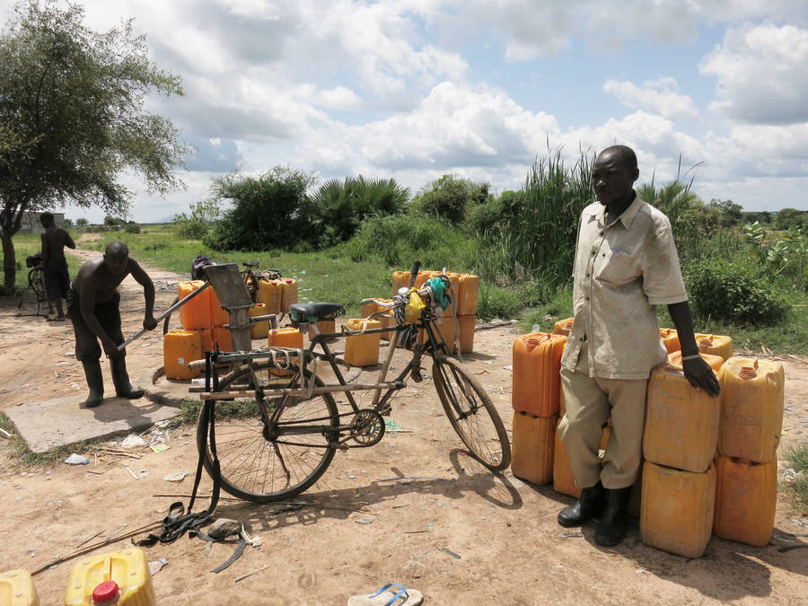 Yellow Jugs Lined Up In South Sudan Wallpaper