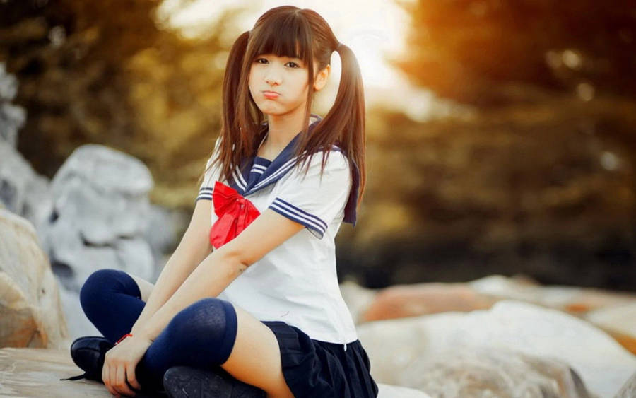 Young Asian Women Wearing School Uniforms Wallpaper