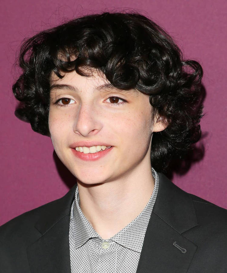 Young Curly-haired Finn Wolfhard Wallpaper